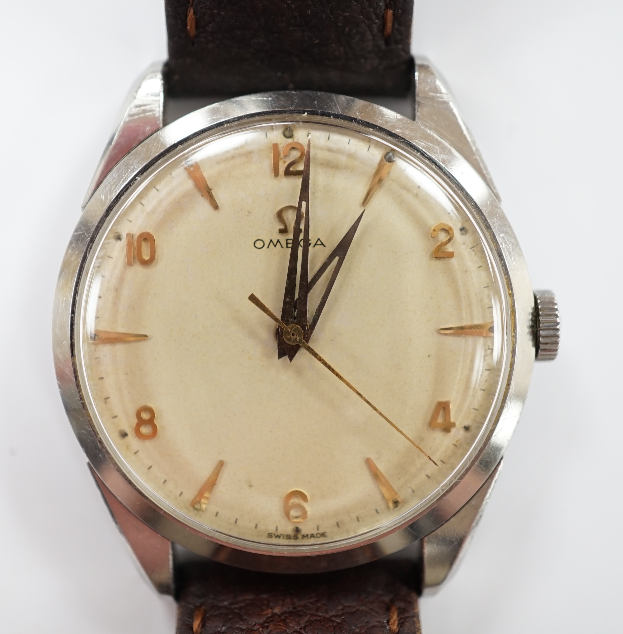 A gentleman's late 1950's stainless steel Omega manual wind wrist watch, with baton and Arabic numerals, movement c.284, on associated strap, case diameter 35mm.